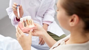 Patient learning about dental implants in Mesquite