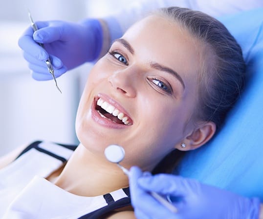 Woman receiving dental checkup