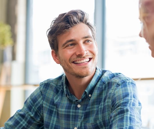 Man sharing smile after metal free dental restoration