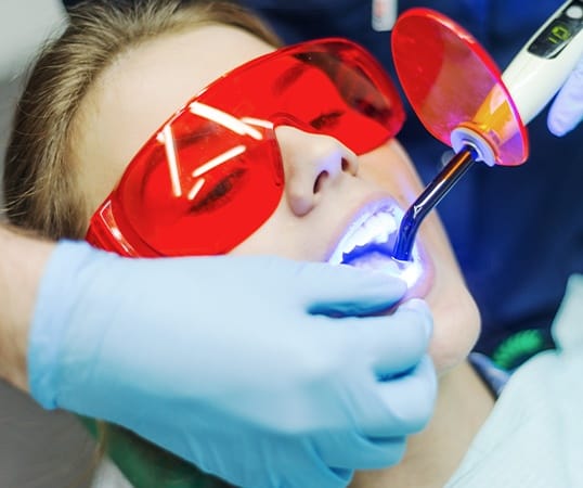 Woman receiving dental bonding