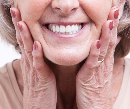 A close-up view of a senior woman’s dentures
