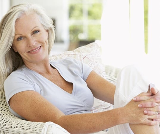 woman smiling with dentures in Mesquite