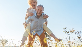 happy couple who worked with an implant dentist in Mesquite