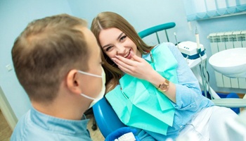 young woman chatting with her sedation dentist in Mesquite