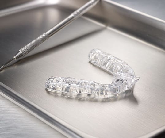 Clear nightguard for bruxism on metal tray