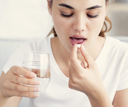 Patient taking oral conscious sedation dentistry pill