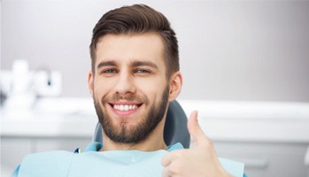 Man giving thumbs-up for oral conscious sedation in Mesquite 