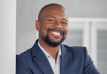 Man sharing smile after replacing missing teeth