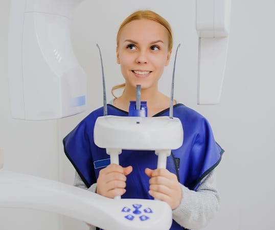 Woman receiving C T cone beam scan